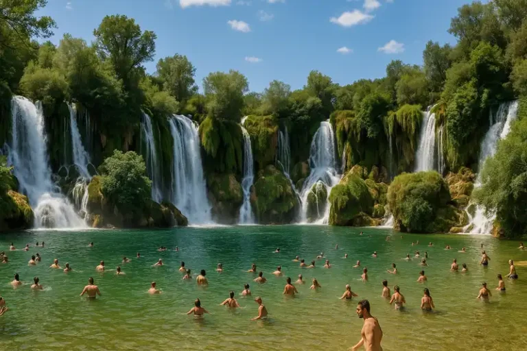 Herzegovina-Neretva Canton 1 A wide, semi-circular cascade of waterfalls tumbles down a lush, green cliff face into a beautiful, emerald-coloured natural pool below, Herzegovina-Neretva Canton, Bosnia and Herzegovina.
