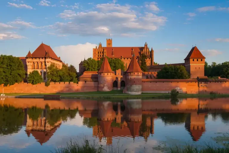 Malbork 4 Malbork skyline with Teutonic Castle at sunset.