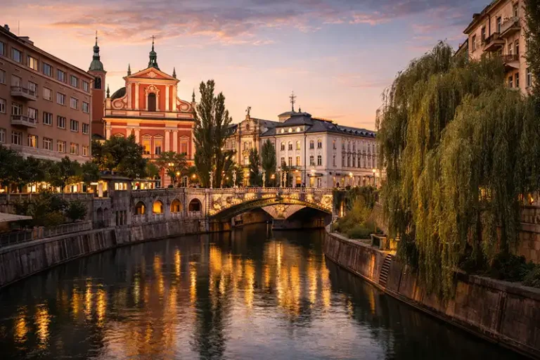 Ljubljana 1 Scenic view of the Triple Bridge and Franciscan Church in Ljubljana, Central Slovenia, during sunset.