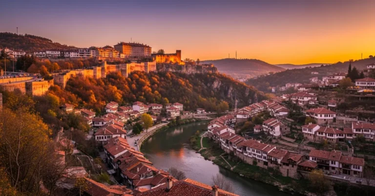 Veliko Tarnovo 26 Panoramic view of Veliko Tarnovo with Tsarevets Fortress and Yantra River at sunset