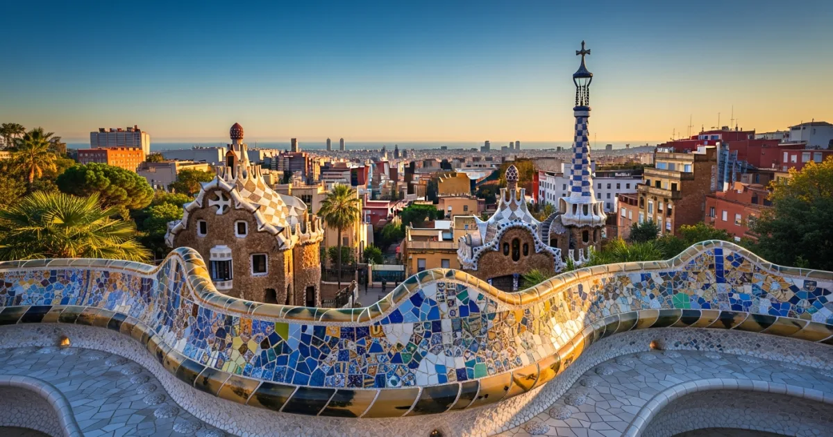 Panoramic view of Park Guell's mosaic terrace overlooking the Barcelona skyline
