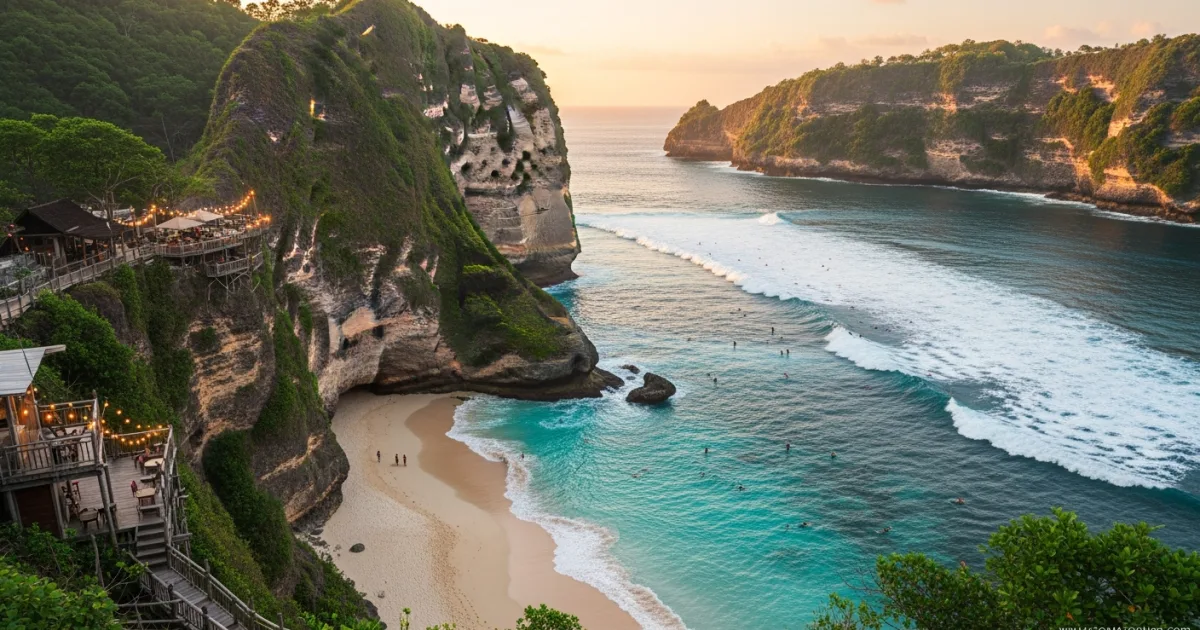 Scenic sunset view of Bingin Beach cliffs and surfers in Bali
