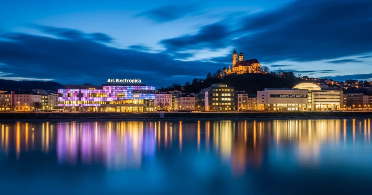 Panoramic view of Linz at twilight featuring the Ars Electronica Center and Danube River