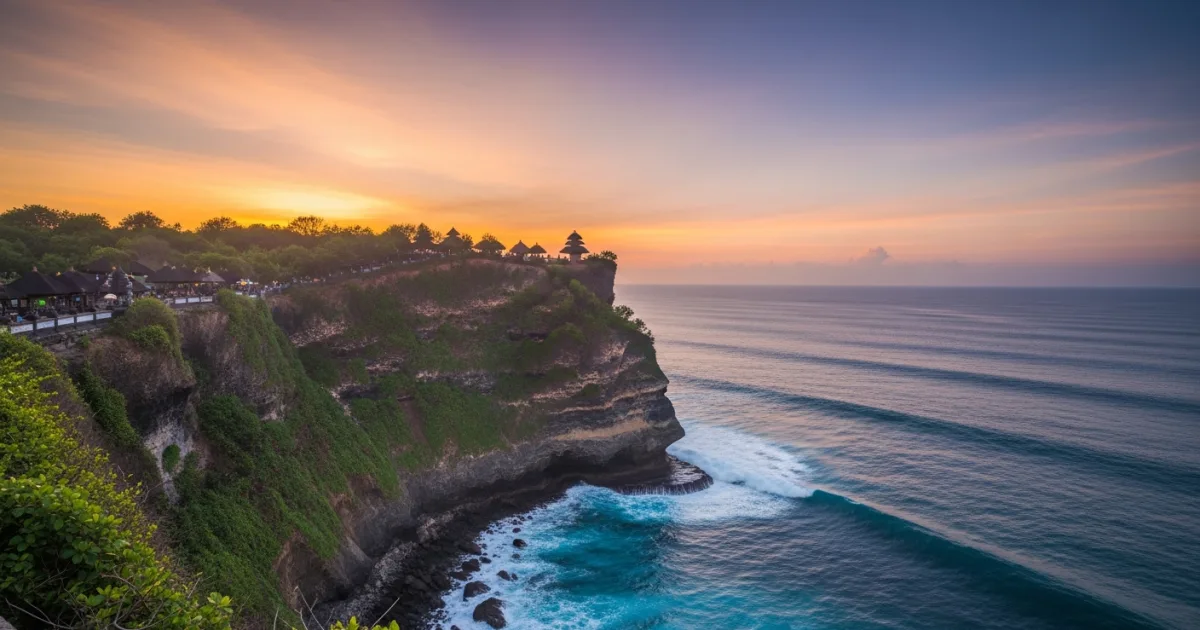Uluwatu Temple perched on a steep cliff overlooking the Indian Ocean at sunset