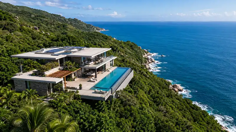 Consider a Full Property Buy-Out 1 An aerial view of a completely isolated private luxury villa with an infinity pool overlooking the ocean