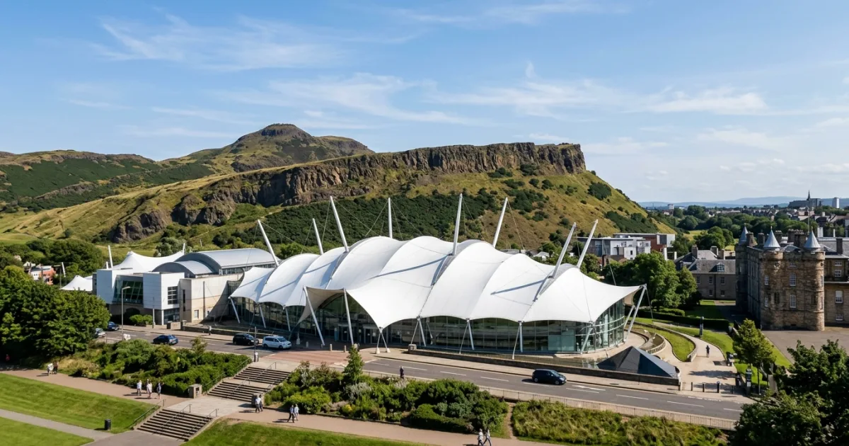 Exterior view of Dynamic Earth in Edinburgh with Arthur's Seat in the background