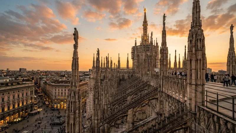 Book 'The Last Supper' Months Ahead 1 Golden hour sunset view over the intricate marble spires of Milan's Duomo cathedral.