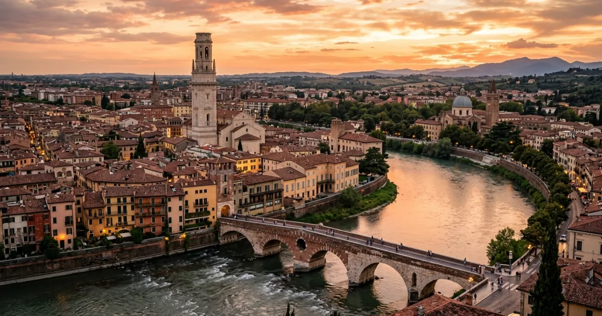 Panoramic view of Verona at sunset featuring the Adige River and Ponte Pietra