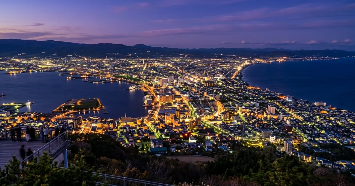 Panoramic nighttime view of Hakodate city isthmus from Mount Hakodate in Southern Hokkaido