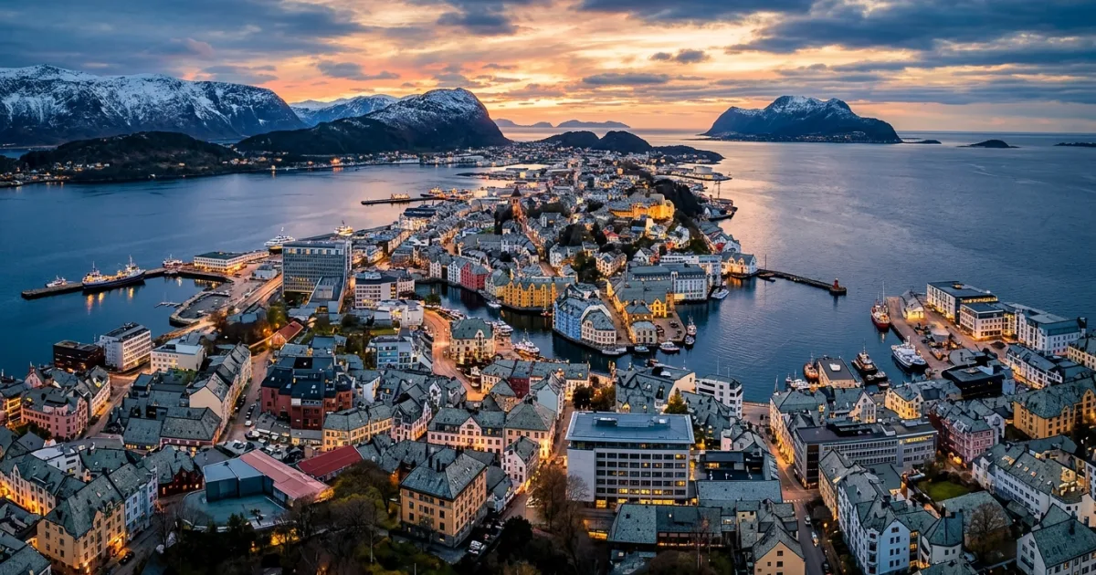Panoramic overview of Alesund canal and Art Nouveau buildings at sunset