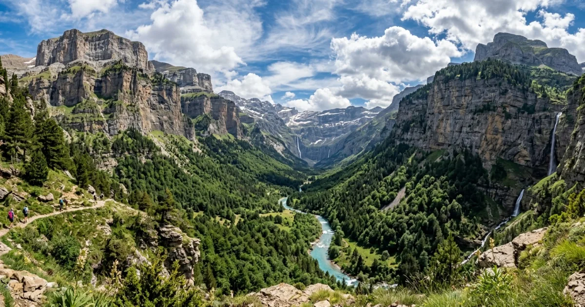 Panoramic view of limestone cliffs and alpine forest in Ordesa Valley, Aragonese Pyrenees