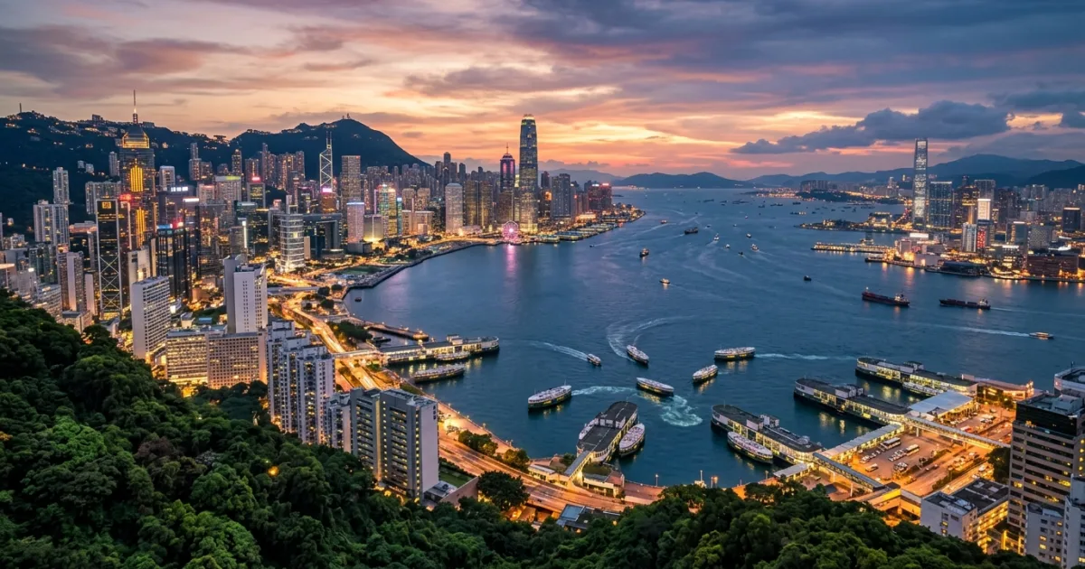 Panoramic view of Hong Kong Island skyline and Victoria Harbour at dusk