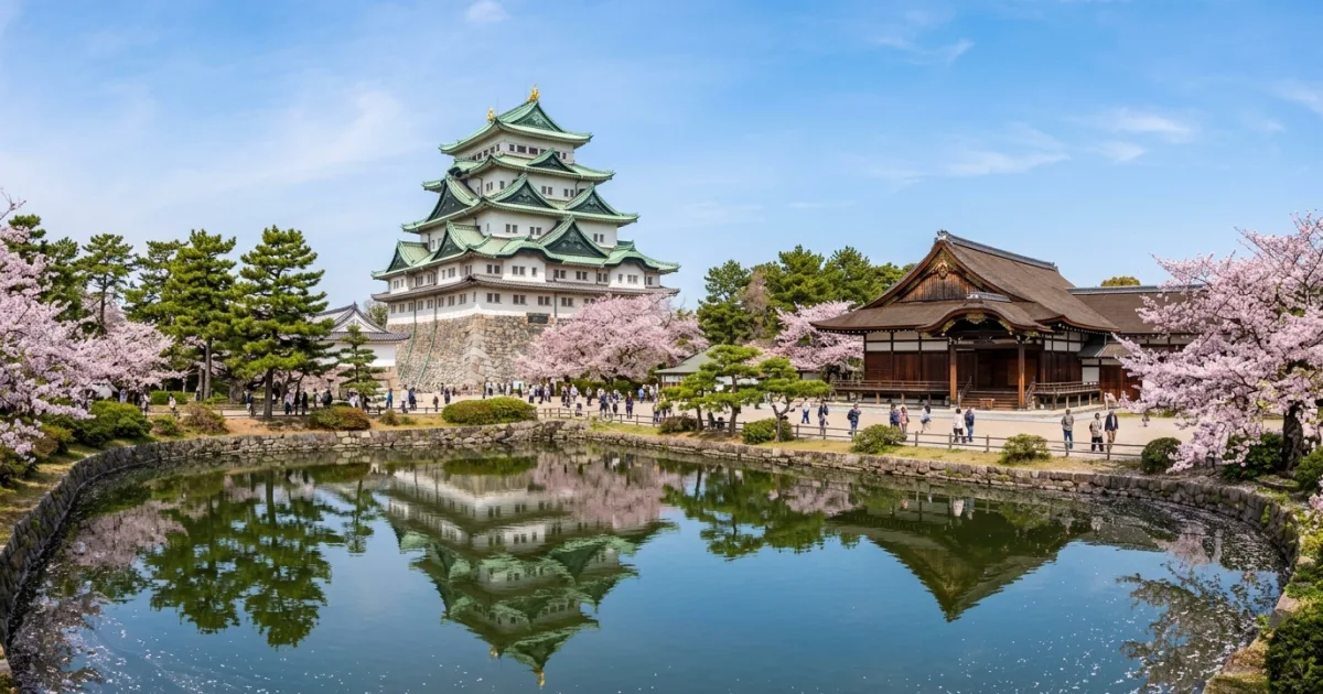 Panoramic view of Nagoya Castle surrounded by cherry blossoms and historic moat