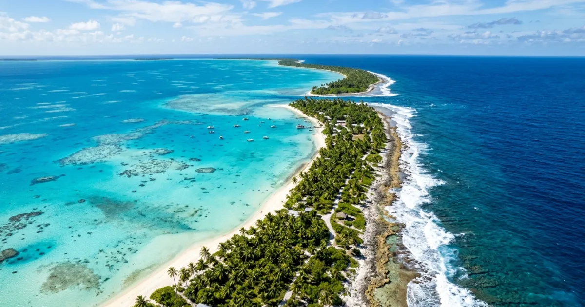 Aerial view of Rangiroa atoll with turquoise lagoon and palm trees