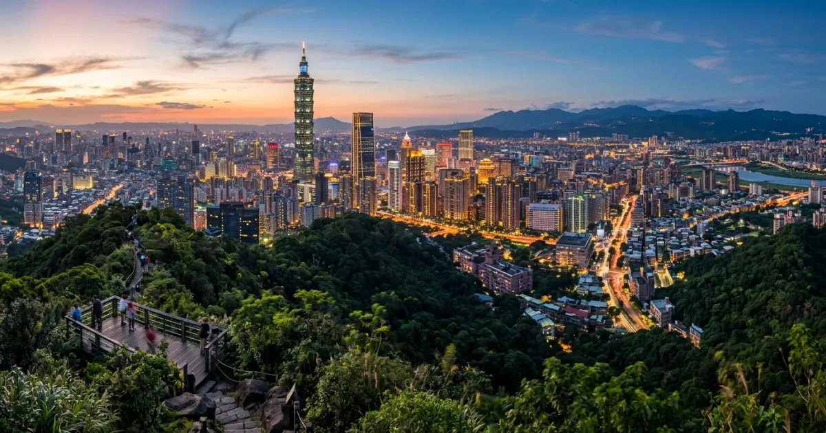 Panoramic golden hour view of Taipei skyline with Taipei 101 tower and surrounding mountains